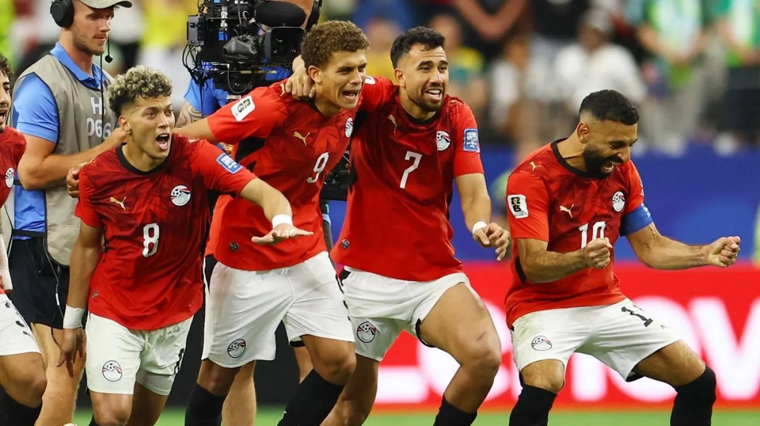 Egypt's Mohamed Salah and teammates celebrate after Hossam Abdelmaguid scored the penalty past Australia's Mathew Ryan to win the shootout and advance to the Round of 16 of the World Cup. (Reuters) 
