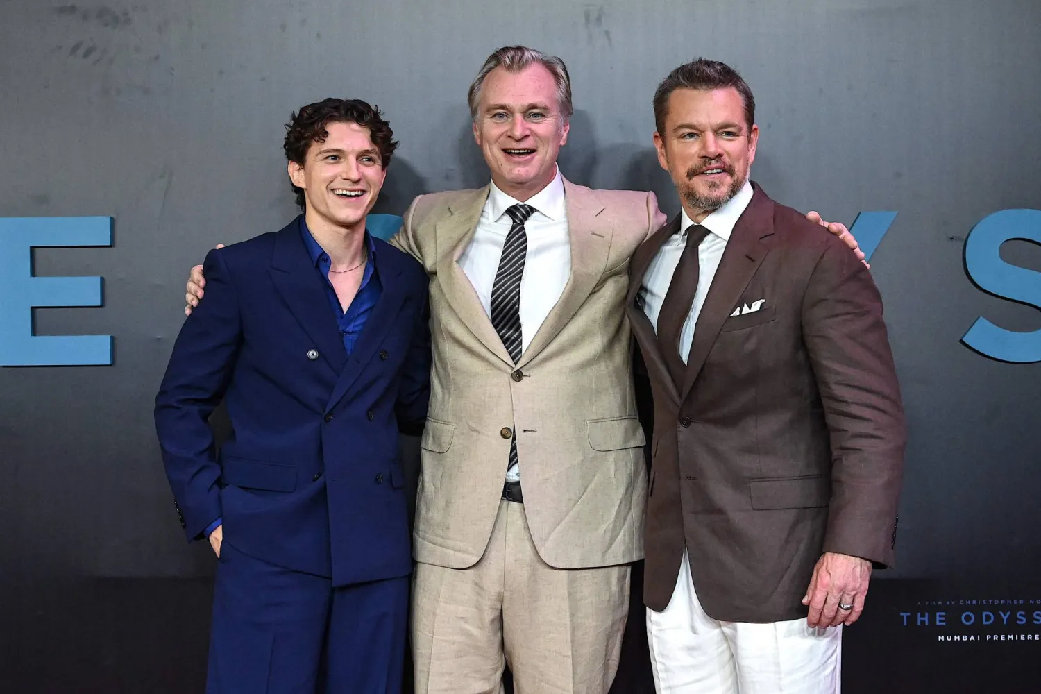  (L-R) English actor Tom Holland, British-American filmmaker Christopher Nolan and US actor Matt Damon pose upon arrival to attend the red carpet for the premiere of their film "The Odyssey" in Mumbai on July 11, 2026. (AFP) 