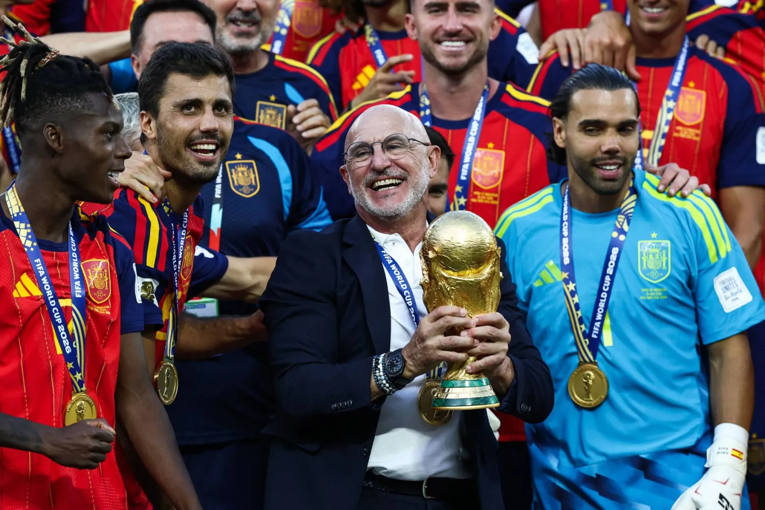 Spain's head coach Luis de la Fuente holds the trophy after winning the 2026 World Cup football tournament final match between Spain and Argentina at the New York/New Jersey Stadium in East Rutherford on July 19, 2026. (AFP)