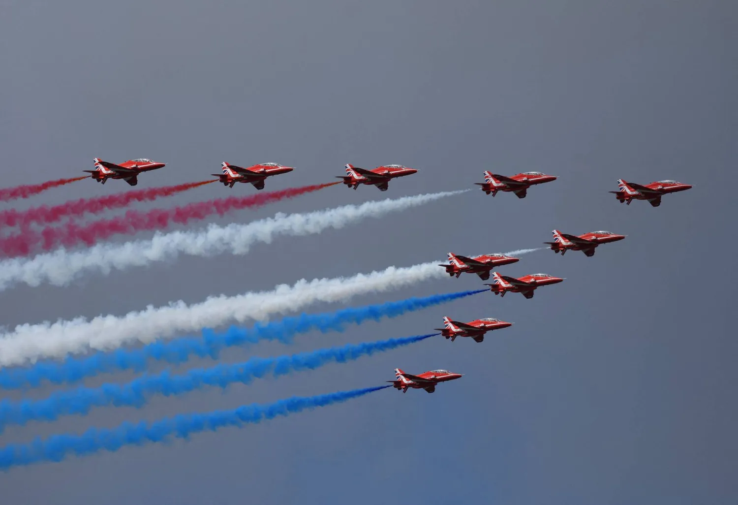 The British Red Arrows display team fly at the Farnborough International Airshow, in Farnborough, Britain, July 22, 2024. (Reuters)