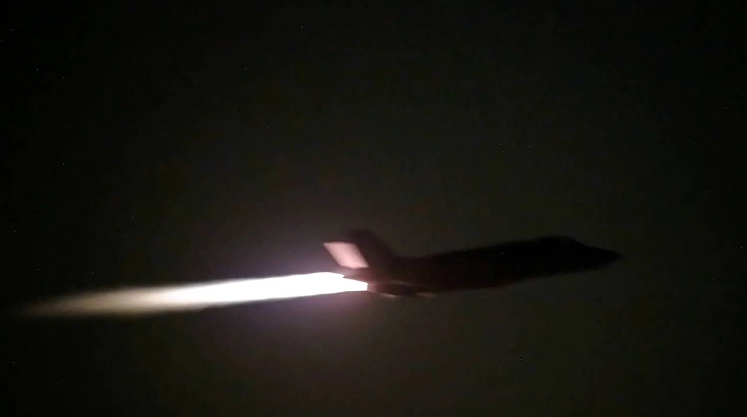 A US military aircraft flies at an unknown location, during what US Central Command (CENTCOM) says are strikes on Iran, in this screengrab taken from a handout video released on July 20, 2026. US Central Command/Handout via REUTERS