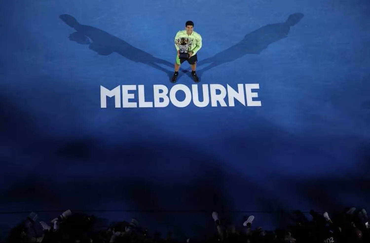 
Tennis - Australian Open - Melbourne Park, Melbourne, Australia - February 1, 2026 Spain's Carlos Alcaraz celebrates with the trophy after winning the Australian Open men's singles against Serbia's Novak Djokovic. REUTERS/Hollie Adams 
