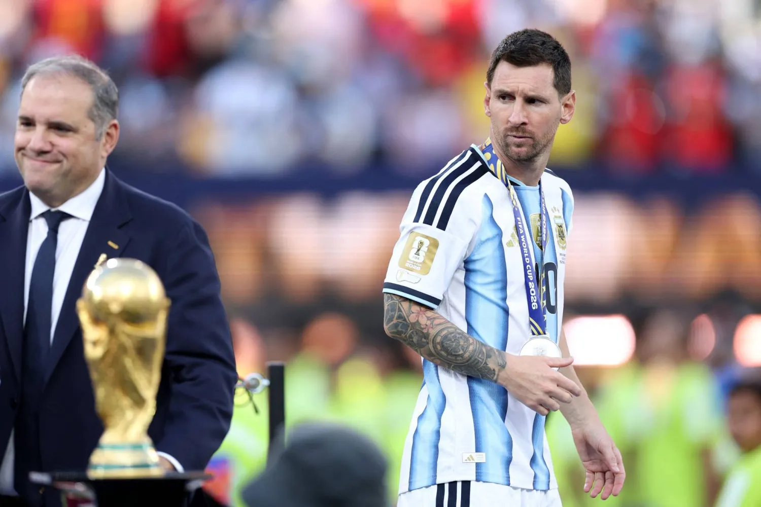 Lionel Messi #10 of Argentina looks at the World Cup trophy after losing the FIFA World Cup 2026 Final match between Winner Spain and Argentina at New York New Jersey Stadium on July 19, 2026 in East Rutherford, New Jersey. (Getty Images/AFP)