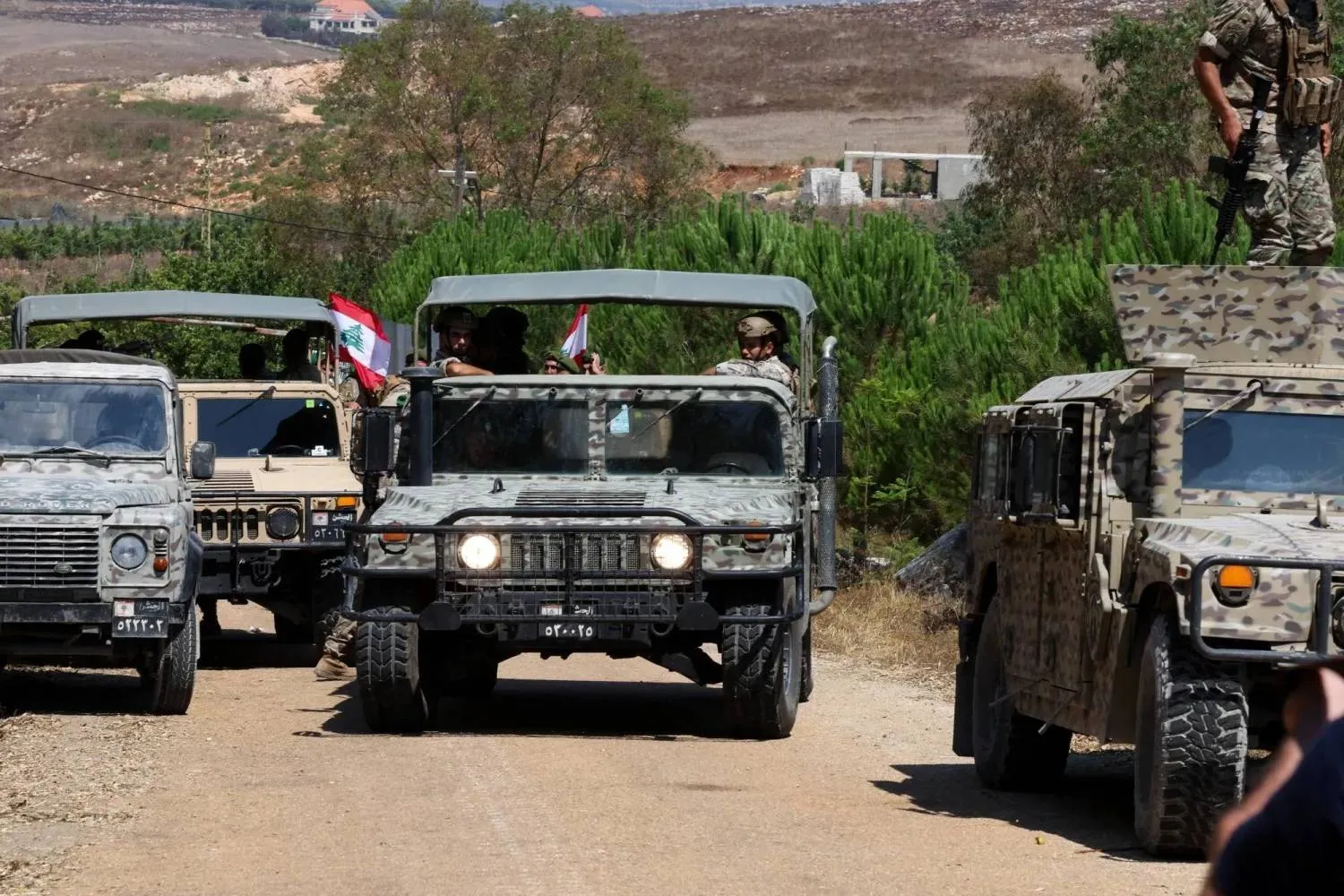Lebanese army soldiers deploy at the entrance to Zawtar al-Gharbiyeh in southern Lebanon after Israeli forces withdrew under a US-brokered plan. (Reuters)