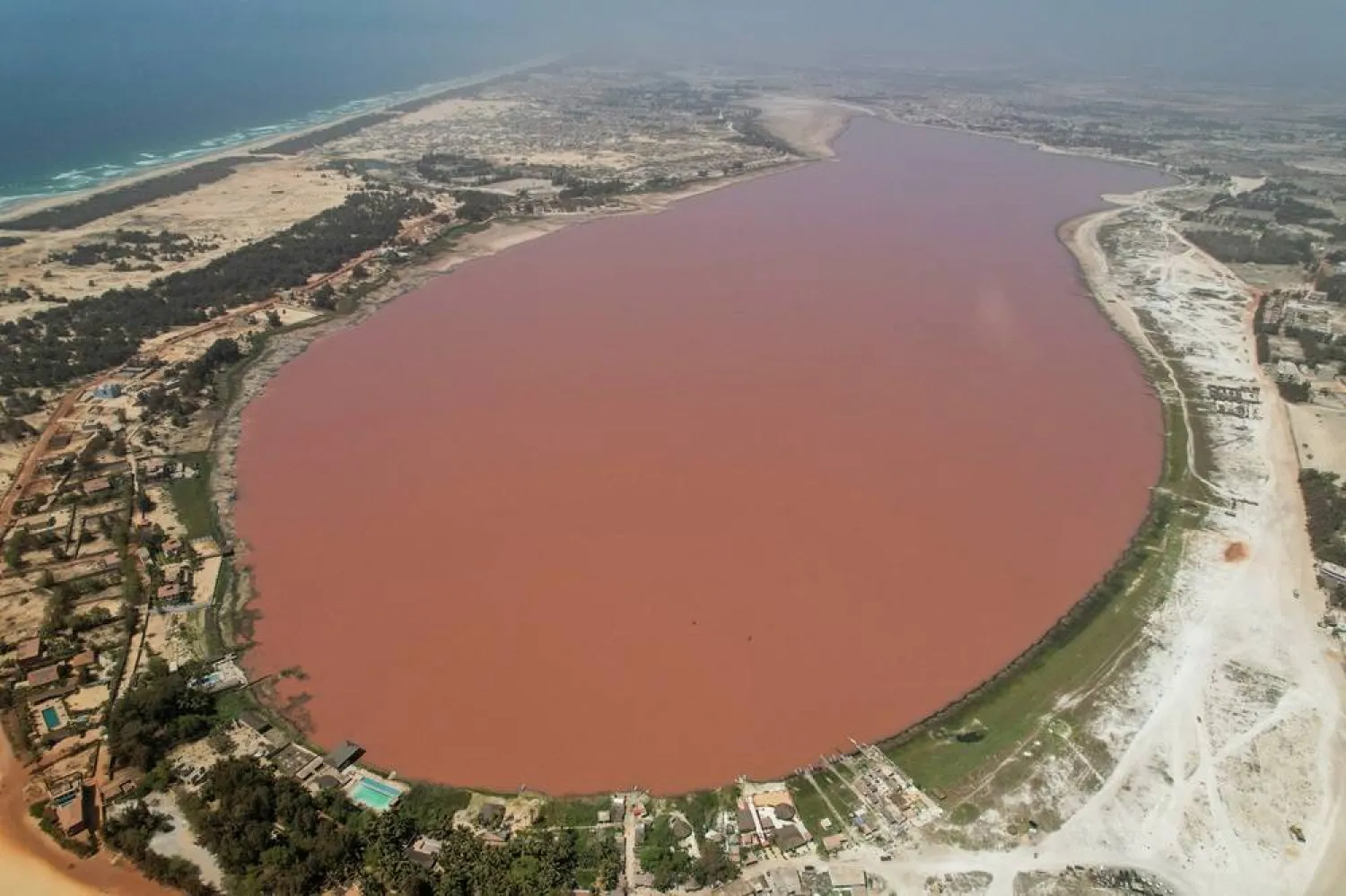 A drone view shows Lac Rose also known as Lake Retba in Niaga, near Dakar, Senegal, June 12, 2025. (Reuters) 