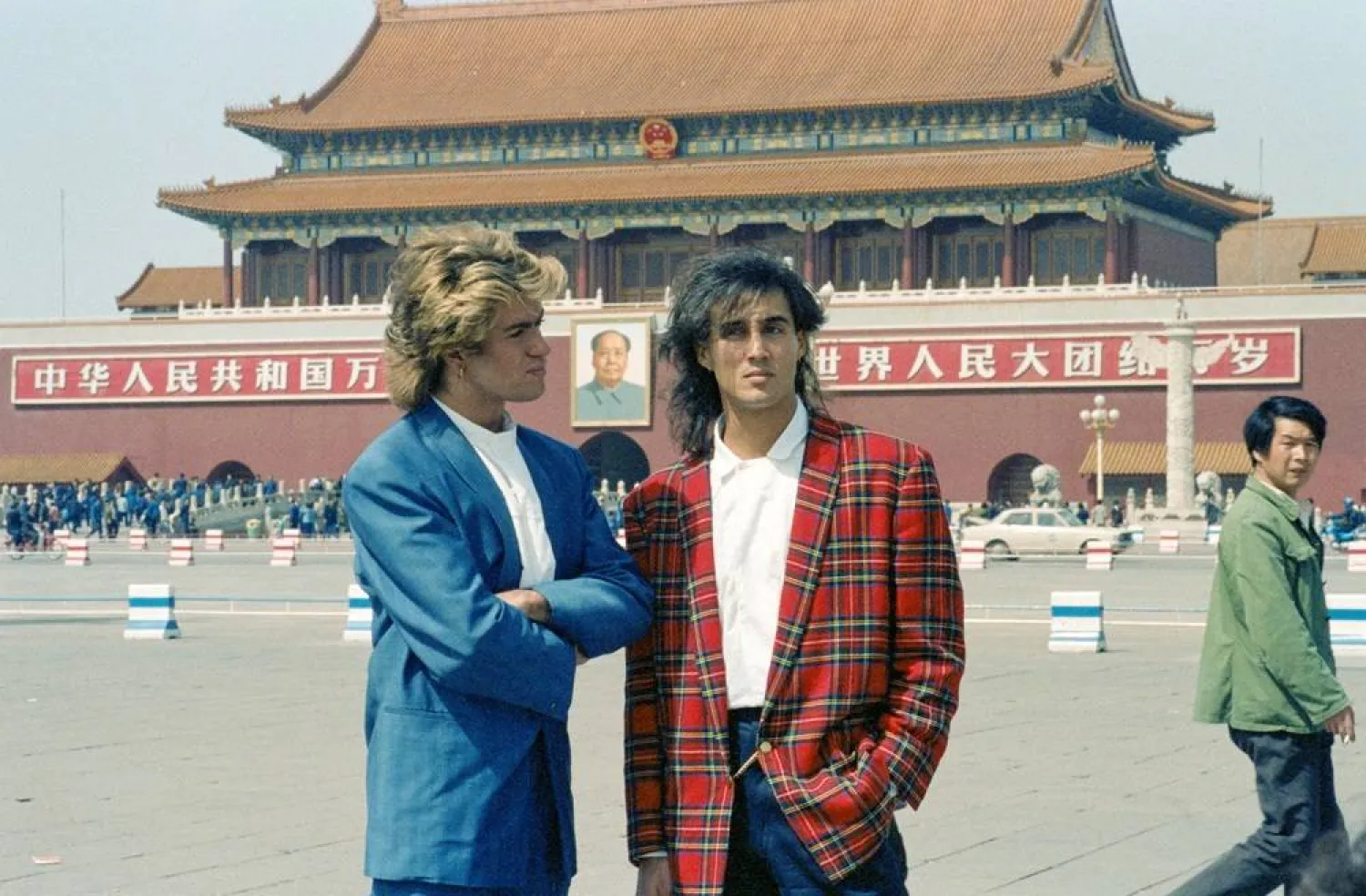 George Michael and Andrew Ridgeley of British pop duo Wham! pose in front of the Tiananmen Gate at Tiananmen Square, during their historic visit to China as the first Western pop act to perform in the country, in Beijing, China, April 7, 1985. (Reuters)