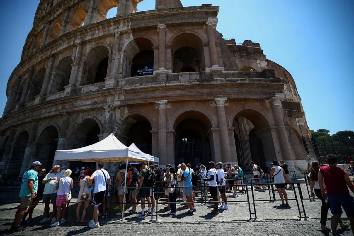 Tourists queue under the sun outside the Colosseum during hot weather in Rome, Italy, June 20, 2026. (Reuters)