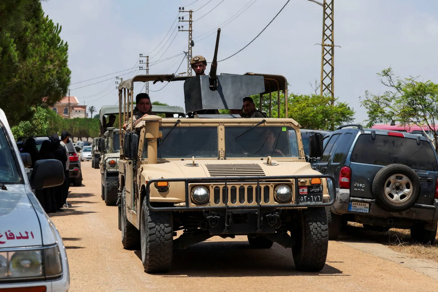 Military members in a vehicle, as residents attempt to enter Zawtar al-Gharbiyeh village as Lebanese army troops deploy in the area following the withdrawal of Israeli forces, under a US-brokered plan, in southern Lebanon, in Zawtar al-Gharbiyeh, Lebanon July 22, 2026. REUTERS/Aziz Taher