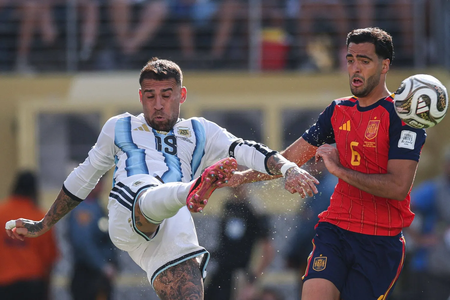 TOPSHOT - Argentina's defender #19 Nicolas Otamendi kicks the ball past Spain's midfielder #06 Mikel Merino during the 2026 World Cup football tournament final match between Spain and Argentina at the New York/New Jersey Stadium in East Rutherford on July 19, 2026.  (Photo by PATRICIA DE MELO MOREIRA / AFP)
