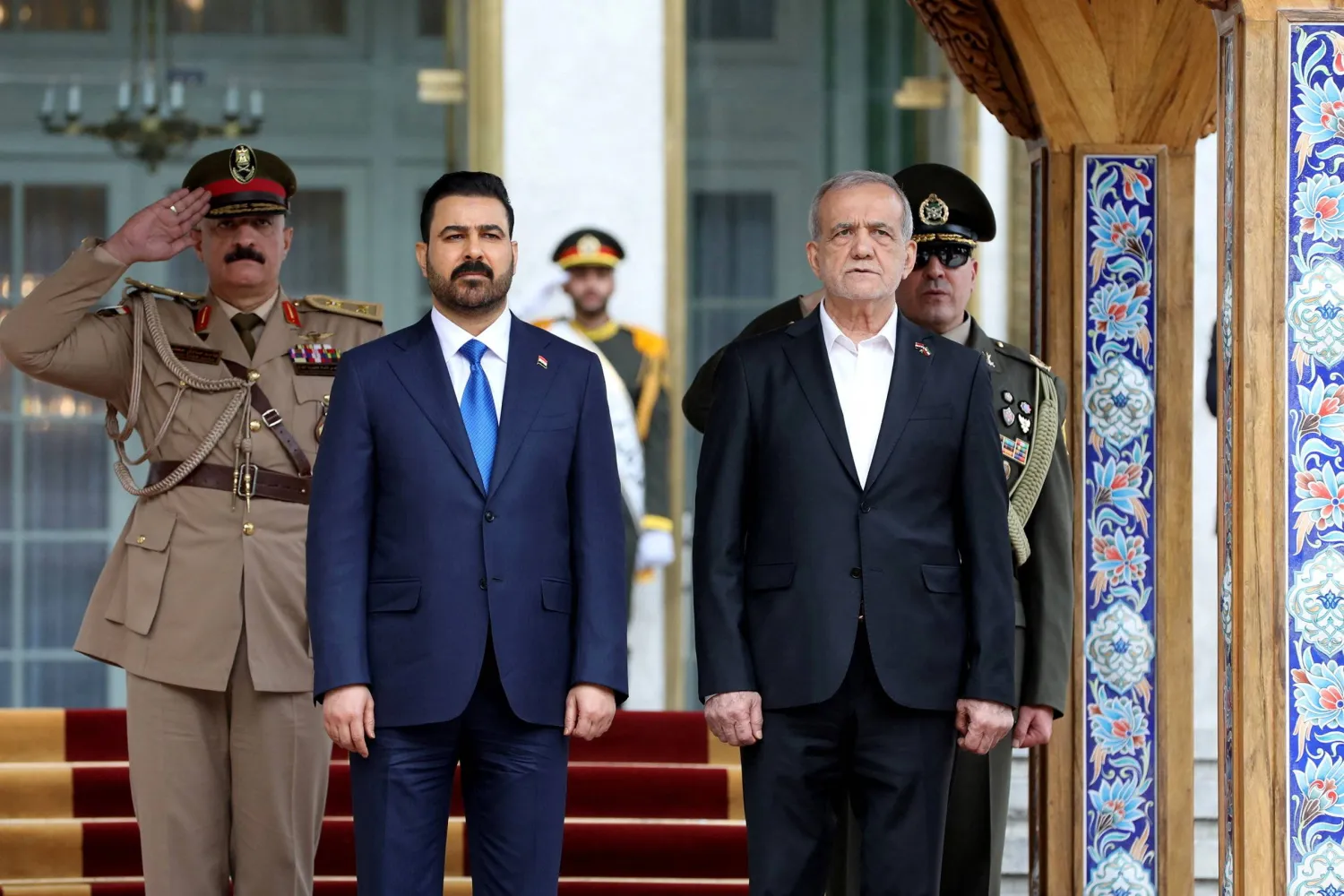 Iraqi Prime Minister Ali al-Zaidi and Iranian President Masoud Pezeshkian attend a welcoming ceremony in Tehran, Iran July 23, 2026. Iran's Presidential website/WANA (West Asia News Agency)/Handout via Reuters