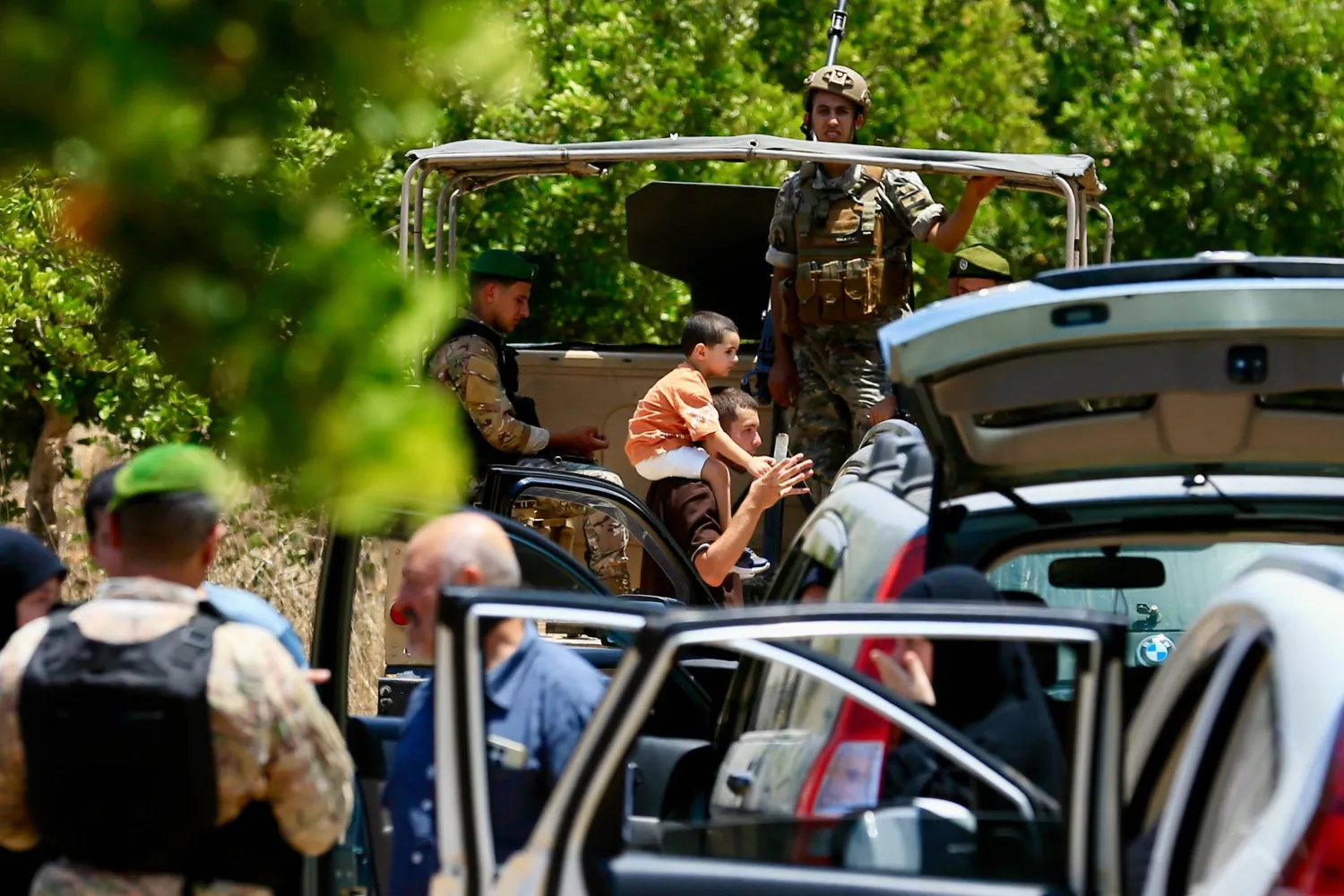 Residents of Zawtar gather near a Lebanese army checkpoint as they are allowed to return to their town following a four-day wait, in Zawtar al-Gharbiyeh, southern Lebanon, 24 July 2026. (EPA)