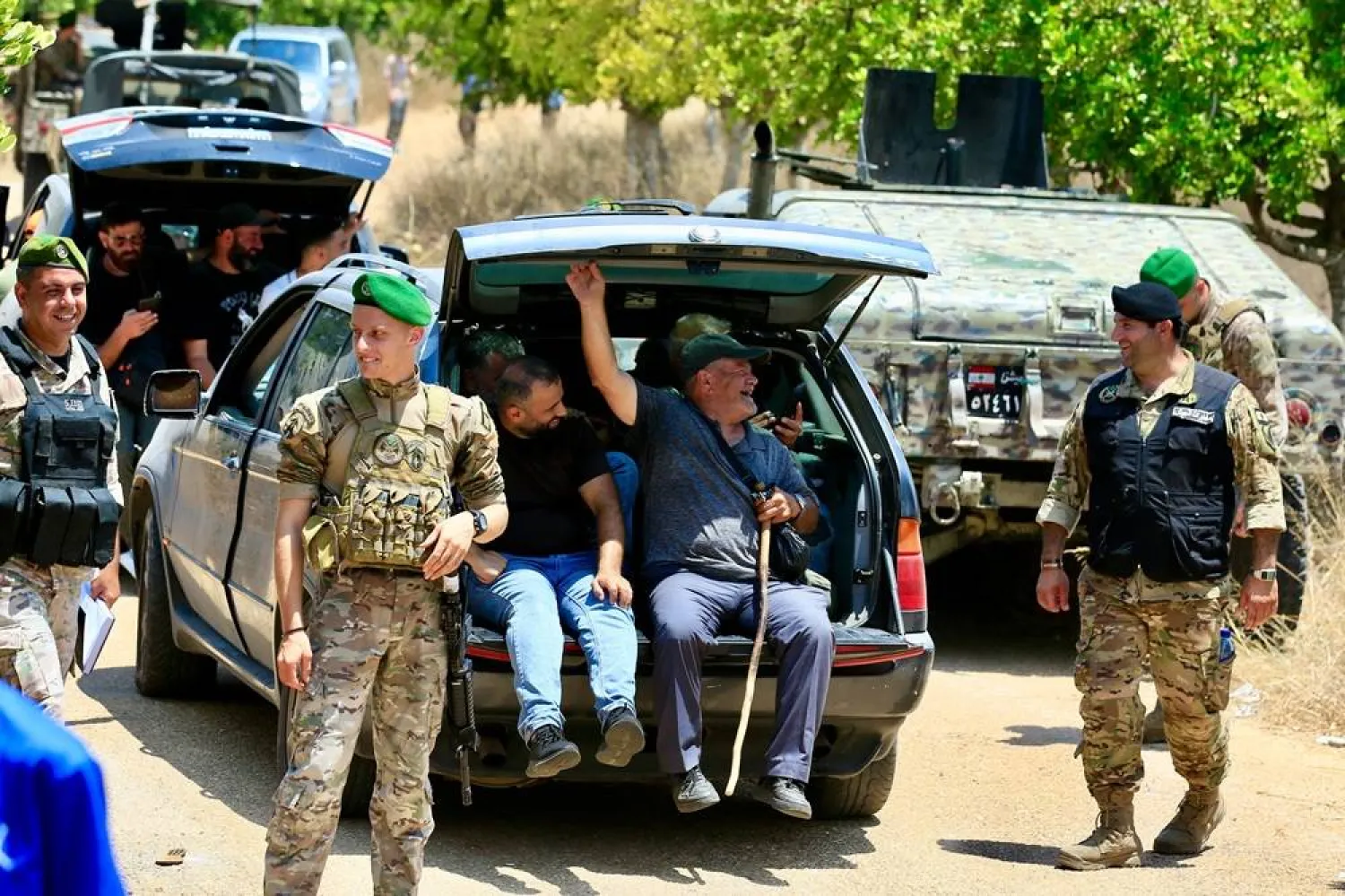 Residents of Zawtar gather near a Lebanese army checkpoint as they are allowed to return to their town following a four-day wait, in Zawtar al-Gharbiyeh, southern Lebanon, 24 July 2026. (EPA)