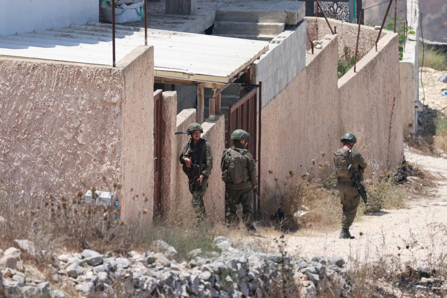 Israeli soldiers patrol the Palestinian village of Tell, in the Israeli-occupied West Bank on July 25, 2026, a day after four Palestinians and two Israelis died in local clashes in the village. (AFP)