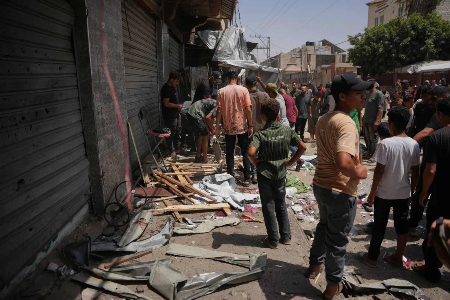 Palestinians inspect the site of an Israeli military strike, in Deir al-Balah, central Gaza Strip, Saturday, July 25, 2026. (AP)