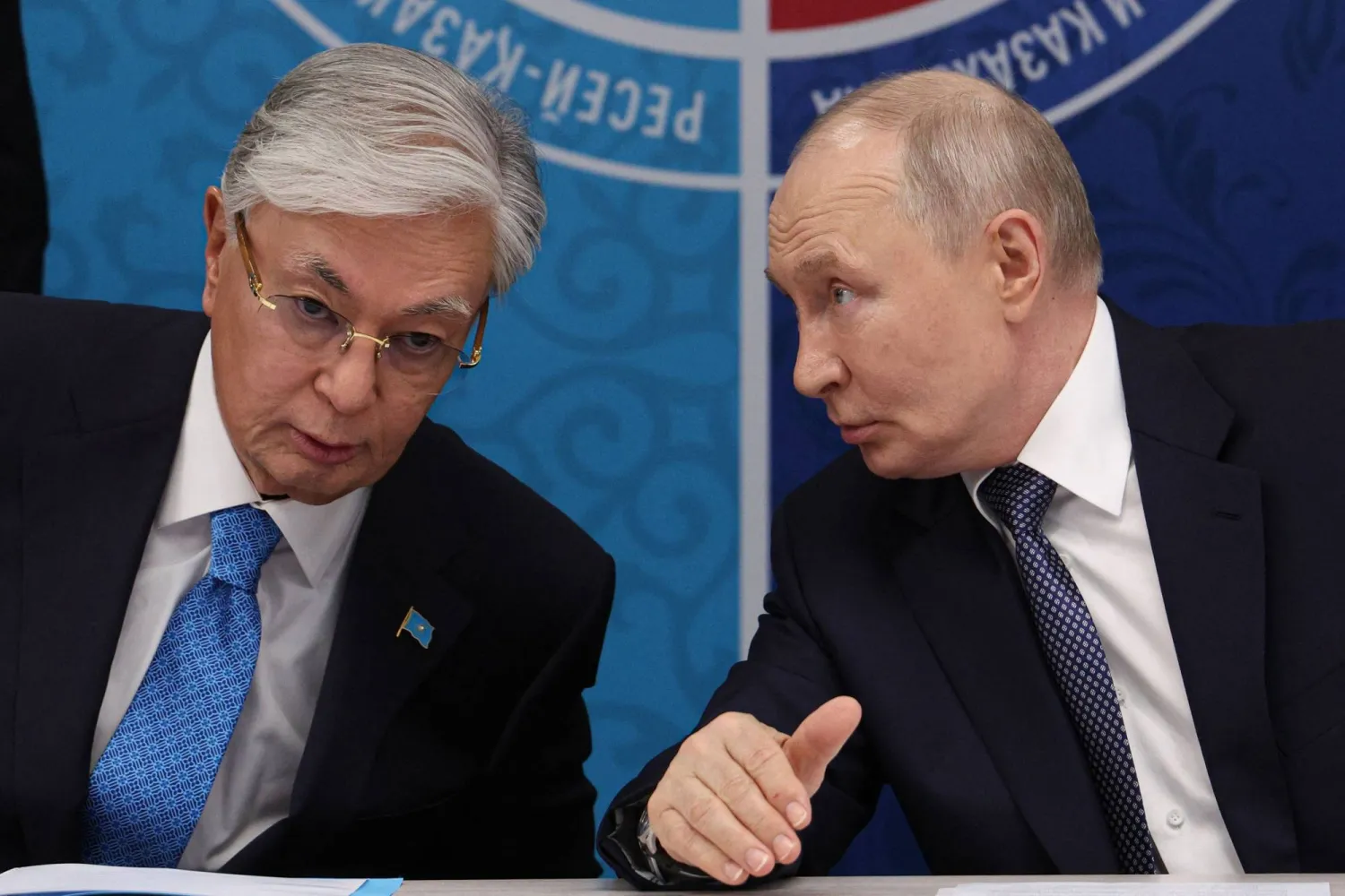  In this pool photograph distributed by the Russian state agency Sputnik, Russia's President Vladimir Putin (R) speaks to Kazakhstan's President Kassym-Jomart Tokayev as they attend the 22nd Russia-Kazakhstan Forum of Interregional Cooperation in Omsk on July 25, 2026. (AFP)