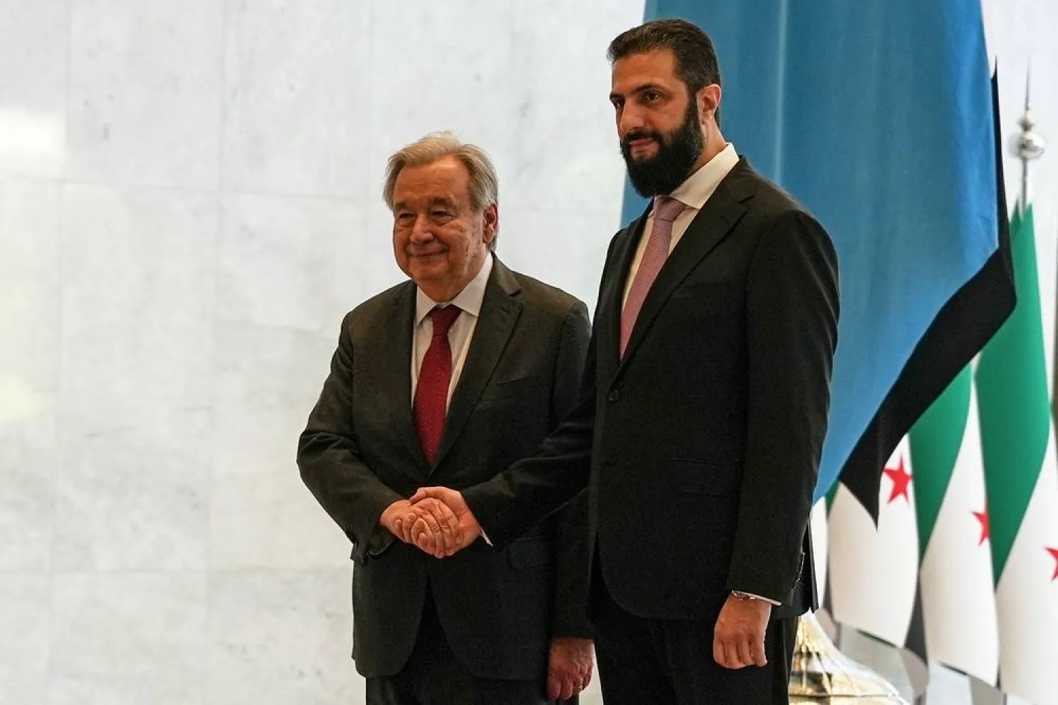 Syrian President Ahmed al-Sharaa, right, welcomes United Nations Secretary General Antonio Guterres at the Syrian presidential palace in Damascus, Syria, Saturday, July 25, 2026. (AP) 