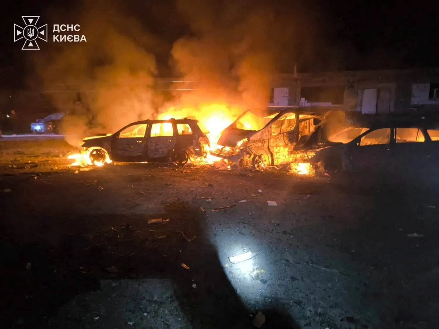 Smoke and fire rise from burning vehicles at a site of a Russian strike, amid Russia's attack on Ukraine, in a location given as Kyiv, Ukraine, in this handout picture released on July 26, 2026. State Emergency Service of Ukraine in Kyiv Region/Handout via REUTERS 