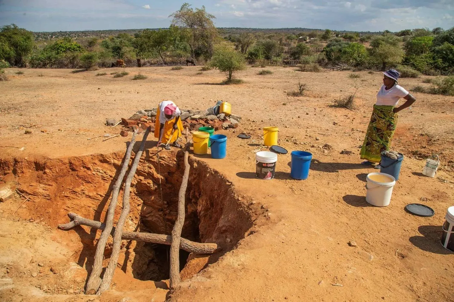Villagers fetch water from a makeshift borehole in Mudzi, Zimbabwe, Tuesday, July 2, 2024. (AP)