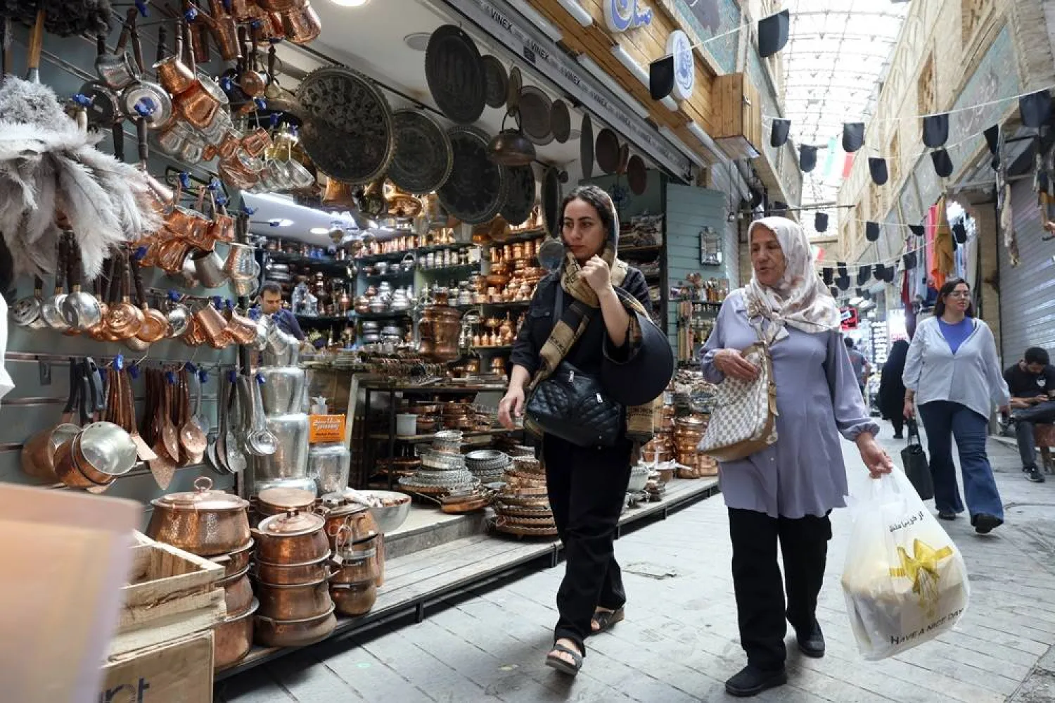 Iranians shop at a bazaar in Tehran, Iran, 27 July 2026. (EPA)