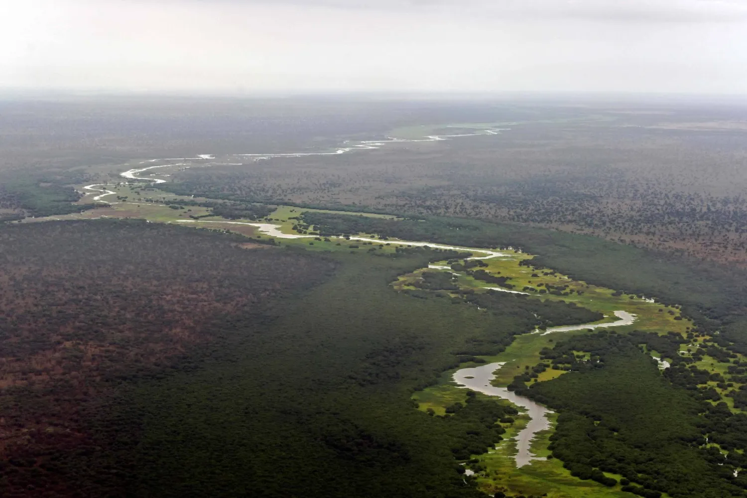An aerial view of the Pibor river flowing across the landscape between Boma and Badingilo national parks on February 4, 2020. (AFP)