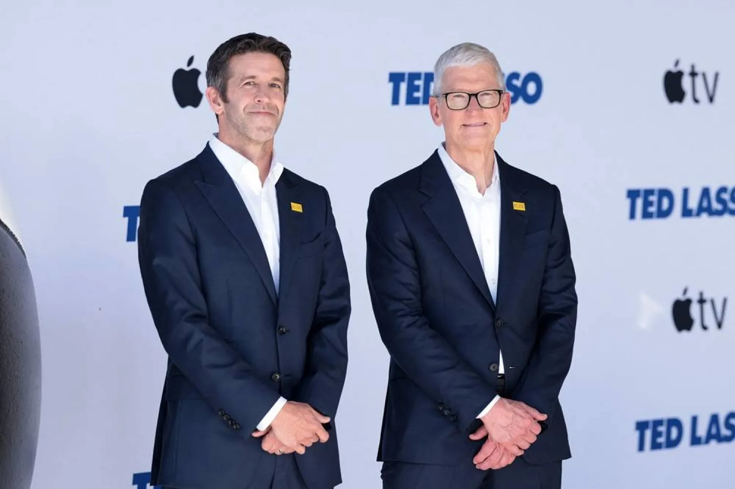  Apple SVP John Ternus (L) and Apple CEO Tim Cook attend the premiere of Apple TV's "Ted Lasso" season 4 at the Academy Museum of Motion Pictures in Los Angeles, California on July 27, 2026. (AFP) 