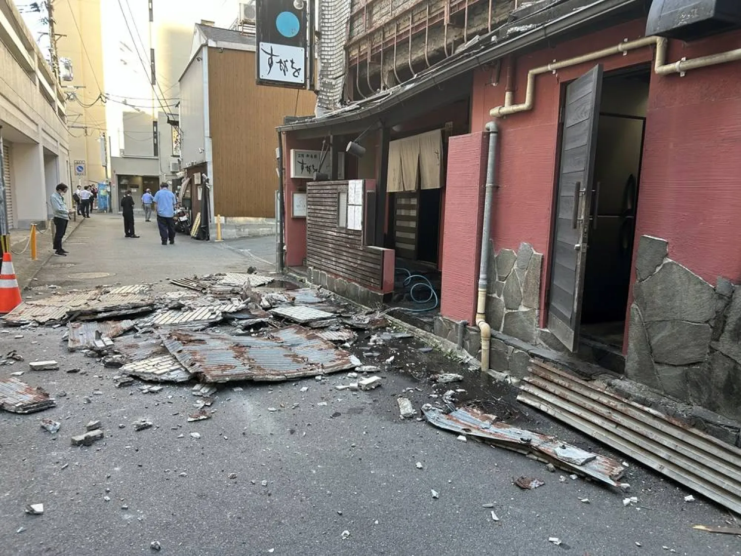 The exterior wall of a restaurant collapsed following the earthquake in Kumamoto City, southwestern Japan, 28 July 2026. (EPA/Jiji Press)