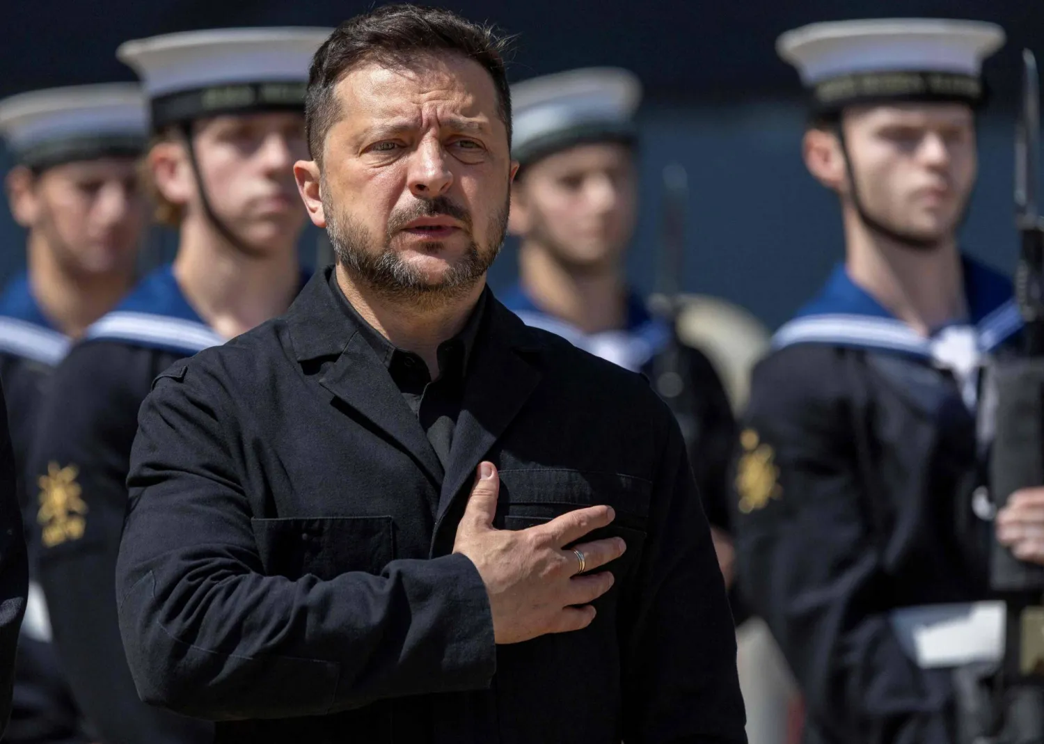 Ukraine's President Volodymyr Zelensky (L) takes part in a welcoming ceremony, during his visit to HM Naval Base in Portsmouth on the south coast of England on July 27, 2026. (AFP)