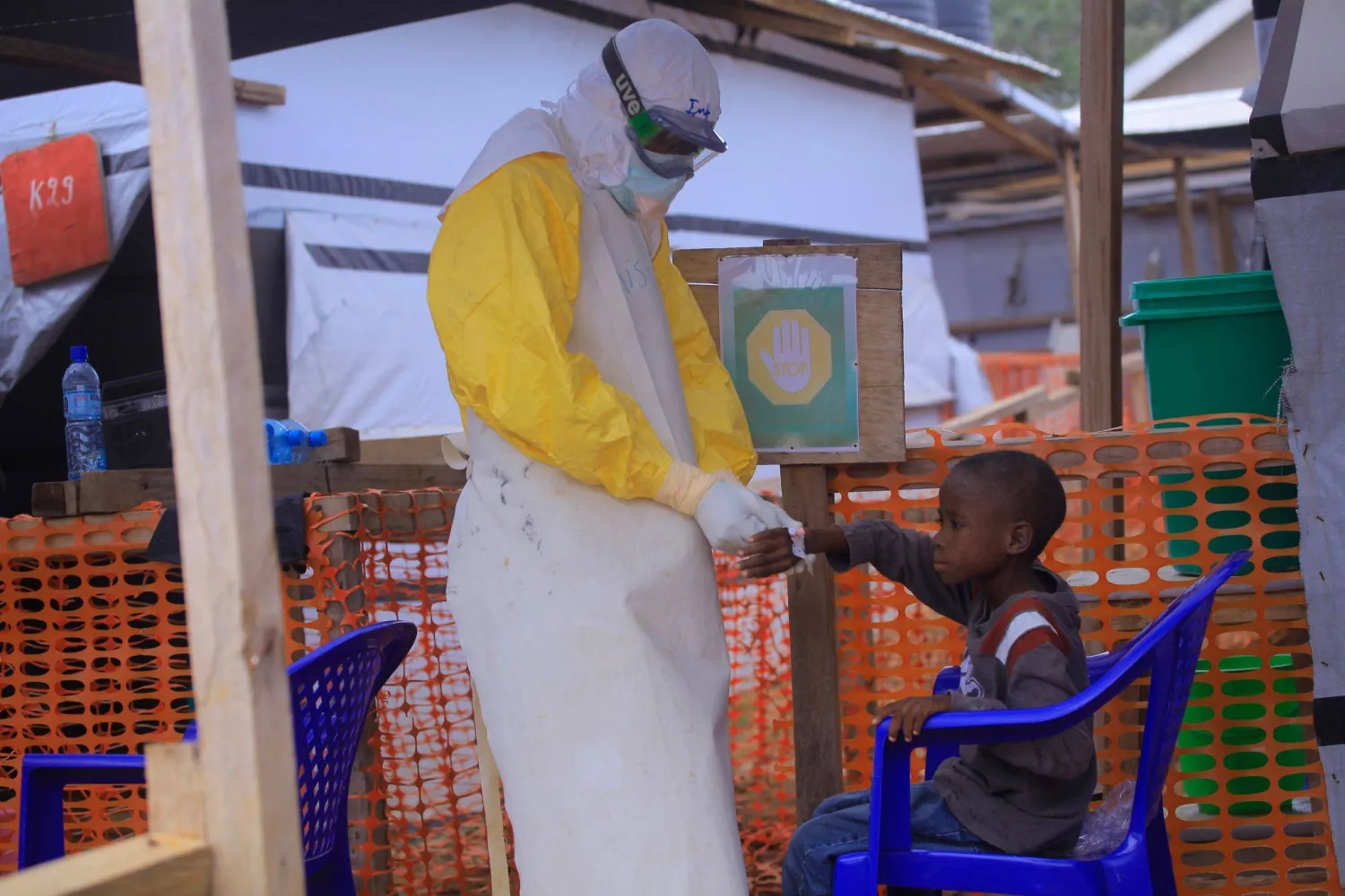 FILED - 20 May 2019, Democratic Republic of Congo, Beni: FILE PHOTO - An Ebola nurse at the CTE ALIMA BENI Ebola Treatment Center cares for a child suspected of having Ebola. Photo: Kitsa Musayi/dpa
