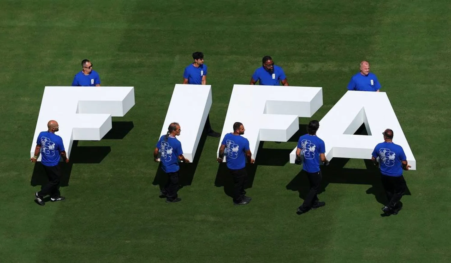 Football - FIFA World Cup 2026 - Final - Spain v Argentina - New York/New Jersey Stadium, East Rutherford, New Jersey, US - July 19, 2026 Pitch staff carry the FIFA logo on the pitch before the match. (Reuters)