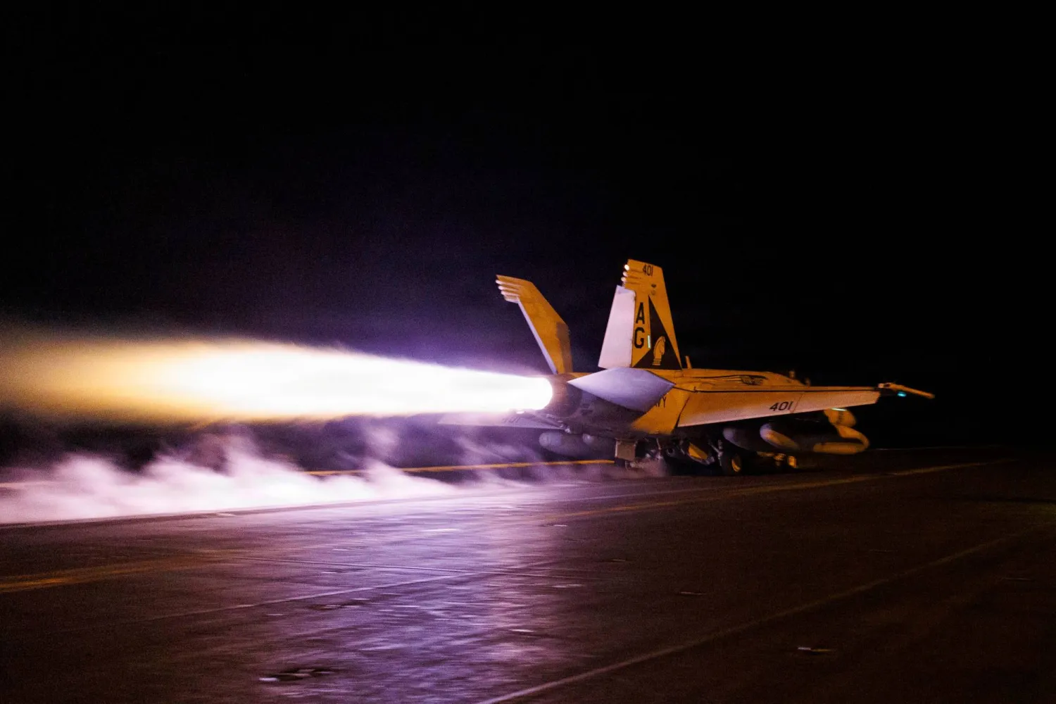 This US Navy handout photograph released on July 28, 2026, by US Central Command Public Affairs shows an F/A-18E Super Hornet launching from the flight deck of Nimitz-class aircraft carrier USS George H.W. Bush, on July 21, 2026. (AFP Photo / US Navy / Navcent Public Affairs / Handout) 