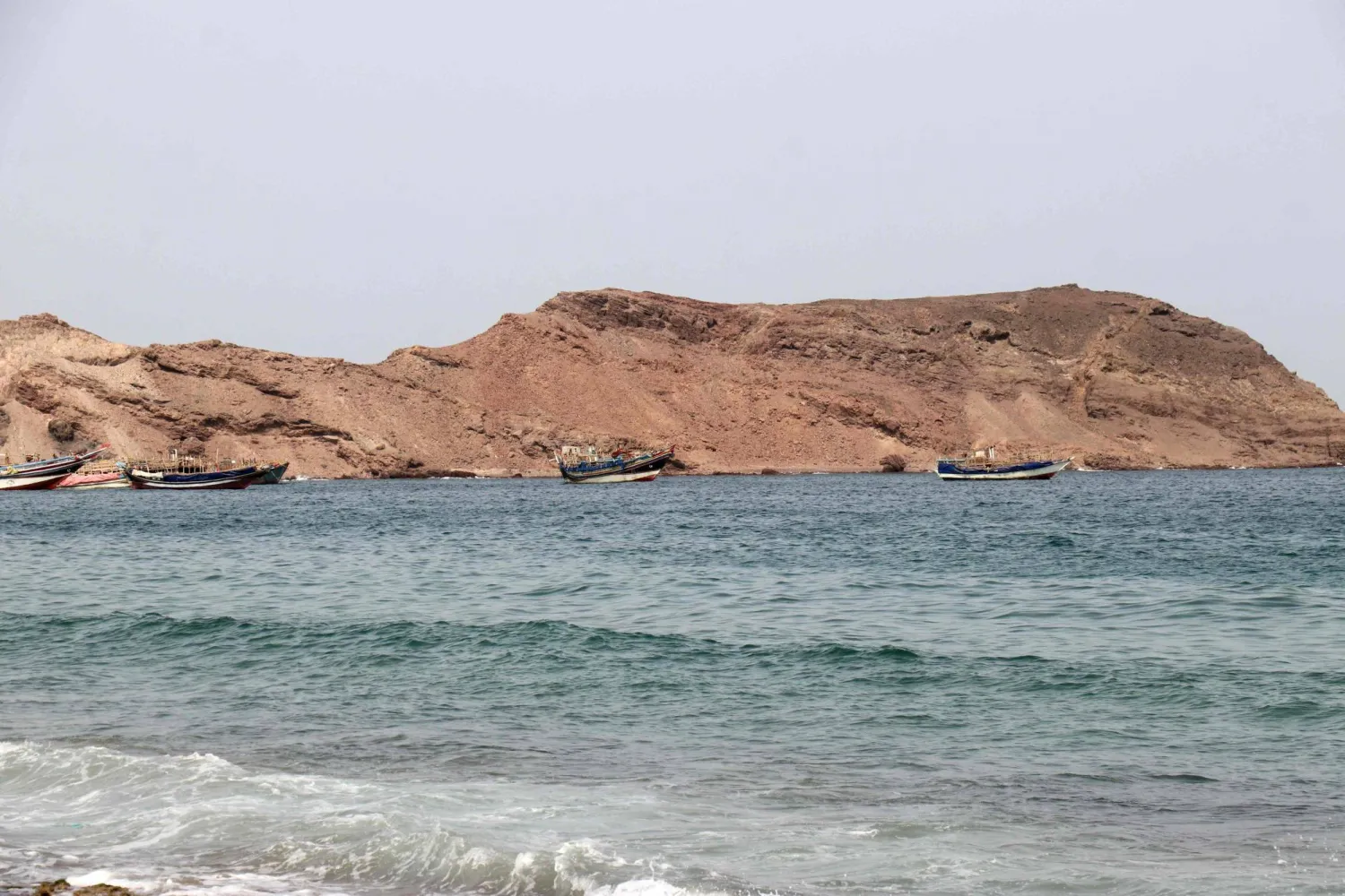 A photo taken from the Yemeni coast southwest of the city of Taiz, shows boats floating at Bab al-Mandab Strait, in the Red Sea, on July 24, 2026. (AFP)