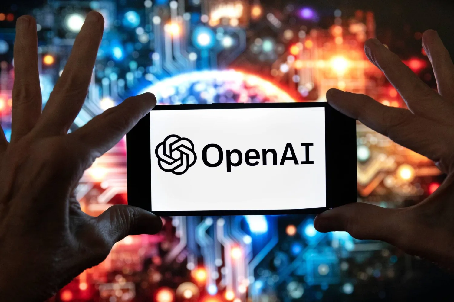 The OpenAI logo is displayed on a cell phone in front of an image generated by ChatGPT's Dall-E text-to-image model, Dec. 8, 2023, in Boston. (AP)