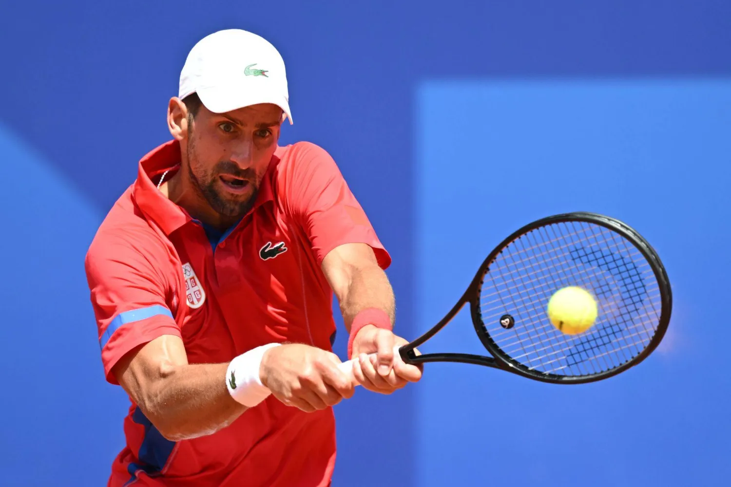 31 July 2024, France, Paris: Serbian tennis player Novak Djokovic in action against Germany's Dominik Koepfer during the Men's Tennis Singles Round of 16 at Roland-Garros Stadium. (dpa)