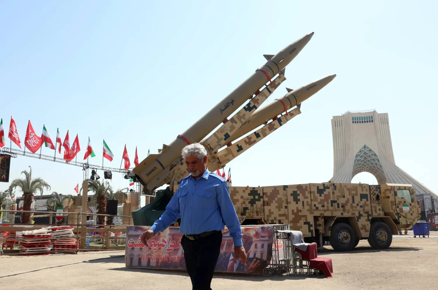An Iranian security man walks next to the Iranian missiles "Zolfaghar" on display at the Azadi square in Tehran, Iran, 30 July 2026. (EPA)