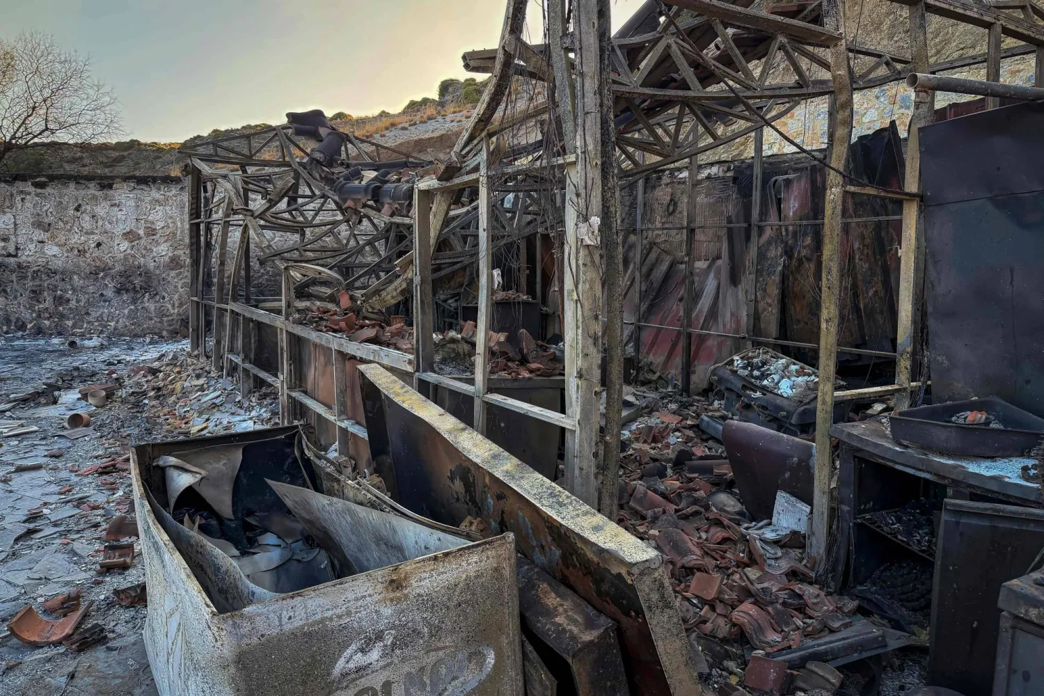 This photograph shows a destroyed beach car following a wildfire at the village of Agios Pavlos in the Greek island of Crete on July 30, 2026. (AFP)