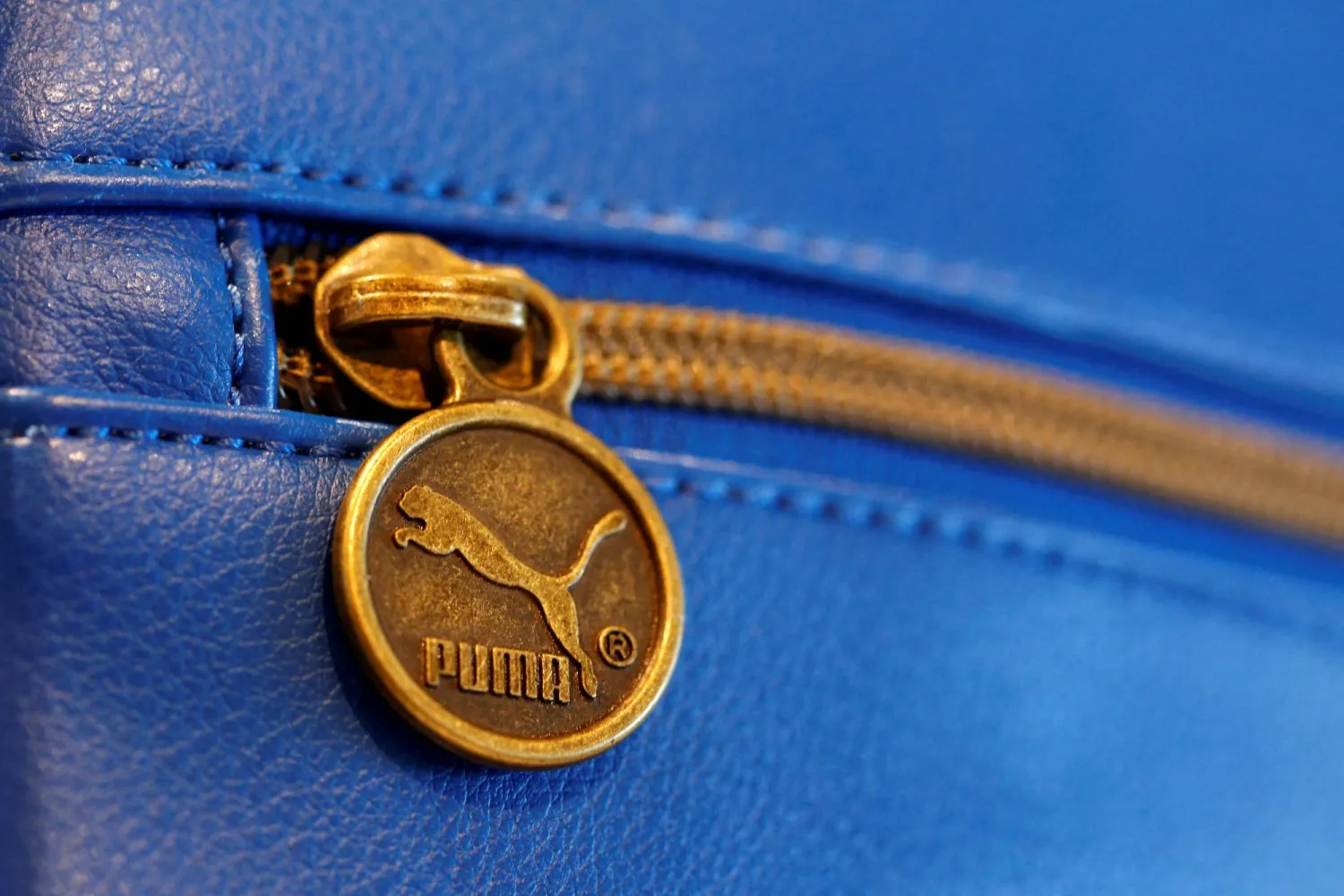 A handbag with the logo of German sports goods firm Puma is pictured in a shop after the company's annual news conference in Herzogenaurach, February 20, 2014. (Reuters)