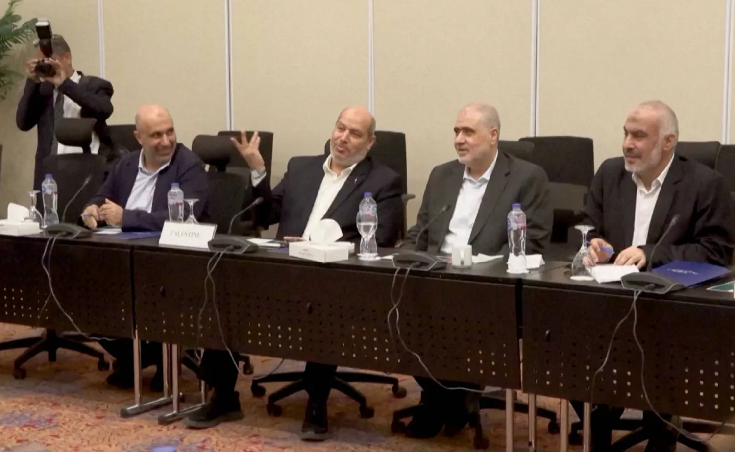 Senior Hamas official Khalil Al-Hayya gestures as he attends a meeting with Egyptian, Qatari and Turkish delegations ahead of a Gaza ceasefire deal announcement, in Sharm El-Sheikh, Egypt, October 8, 2025, in this still image obtained from a video. Al-Qahera News/Handout via REUTERS 