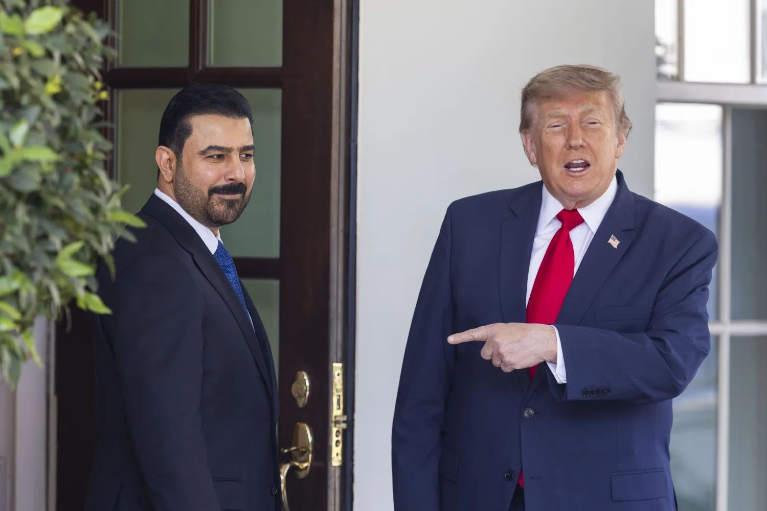 US President Donald Trump (R) greets Iraqi Prime Minister Ali al-Zaidi outside the West Wing of the White House in Washington, DC, USA, 14 July 2026. (EPA)