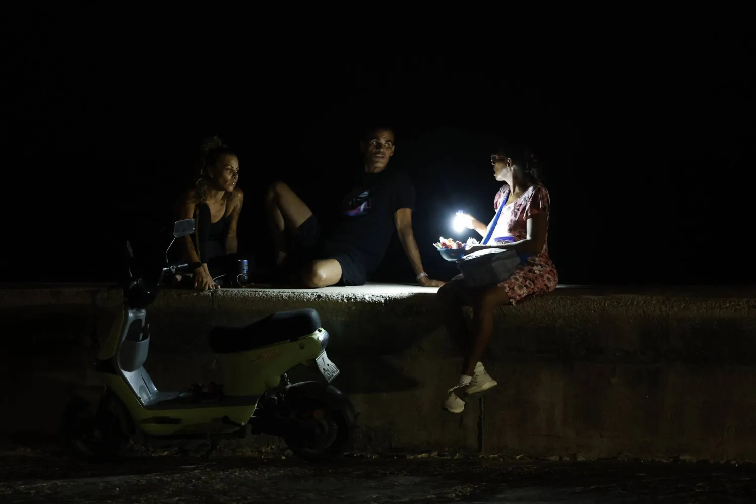 People talk during a power outage in Havana, Cuba, 01 August 2026. EPA/Ernesto Mastrascusa