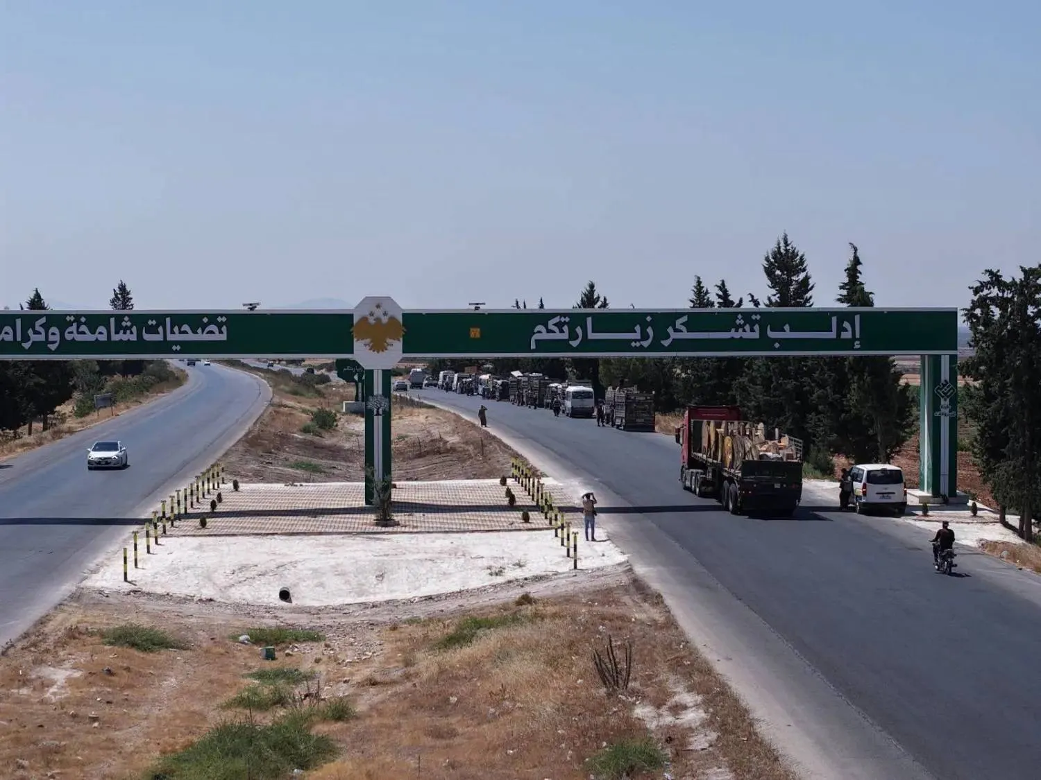 A voluntary return convoy departs from camps in northern Syria in Idlib, heading to the northern Hama countryside. (Ministry of Emergency and Disaster Management)
