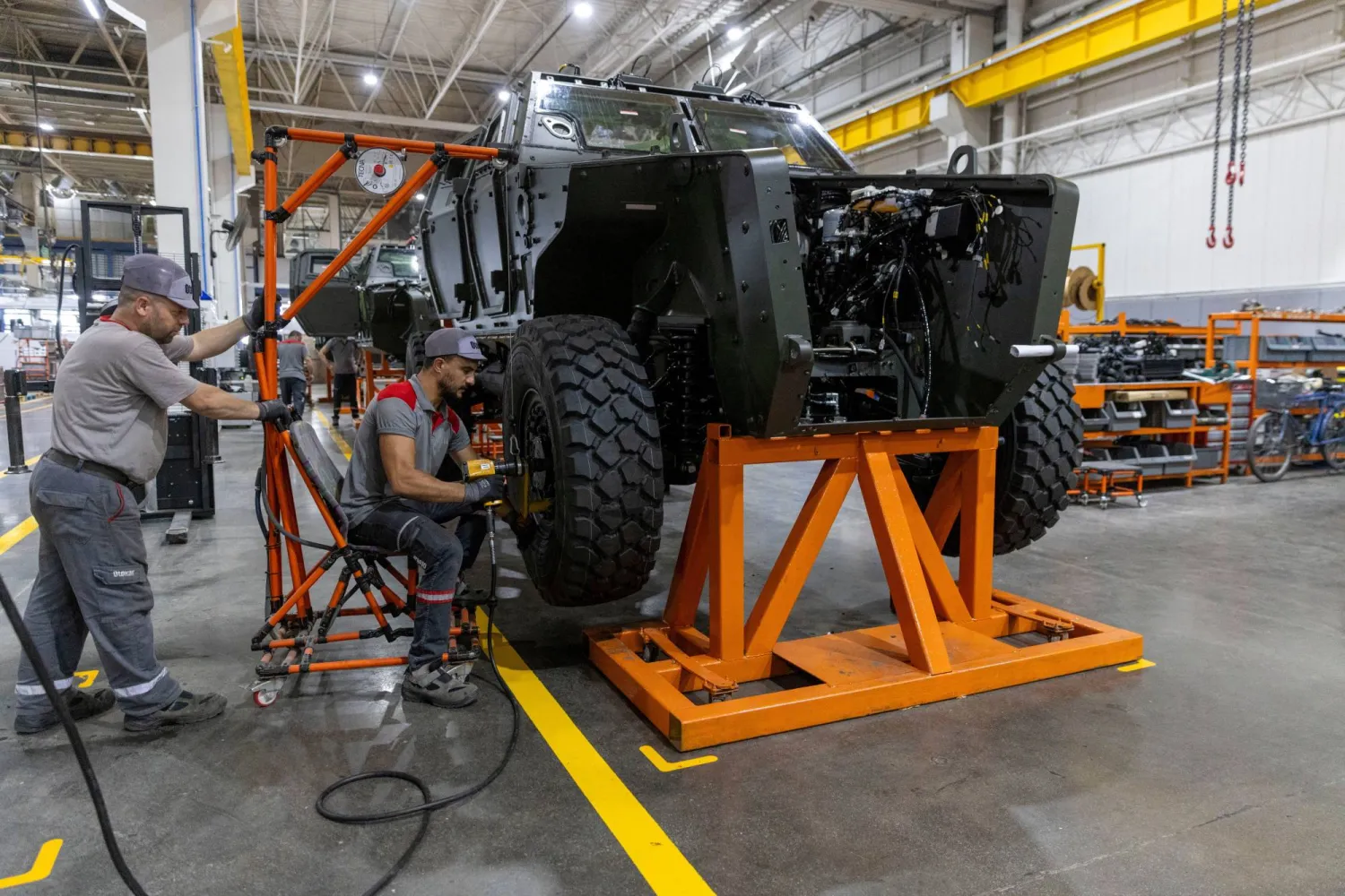 Technicians work on a Cobra II, armored personnel carrier, at a production line at Türkiye's heavy commercial and armored vehicle manufacturer Otokar factory in Arifiye, a town in Sakarya province, Türkiye, July 13, 2023. REUTERS/Umit Bektas/File Photo  