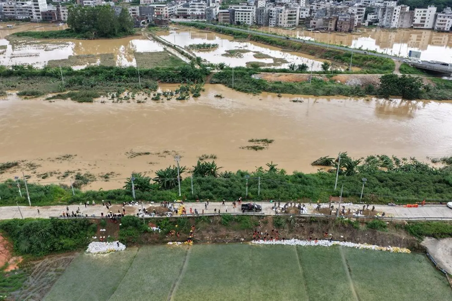 A drone view shows villages surrounded by floodwaters after heavy rainfall under the influence of Typhoon Noul, in Wuhua county, Meizhou city, Guangdong province, China, July 27, 2026. (cnsphoto via Reuters)