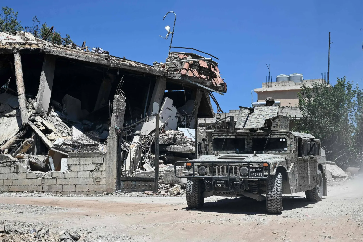 Lebanese soldiers patrol in Zawtar al-Gharbiyeh on July 28, 2026, as residents return to inspect their homes after the army deployed to the southern village as part of a framework deal reached with Israel. (AFP) 