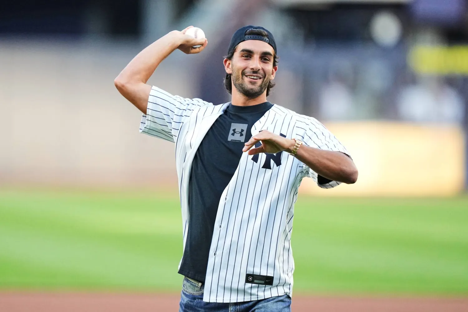 Ferran Torres of Team Spain throws out a ceremonial first pitch before a baseball game between the New York Yankees and the St. Louis Cardinals Tuesday, Aug. 4, 2026, in New York. (AP Photo/Frank Franklin II)