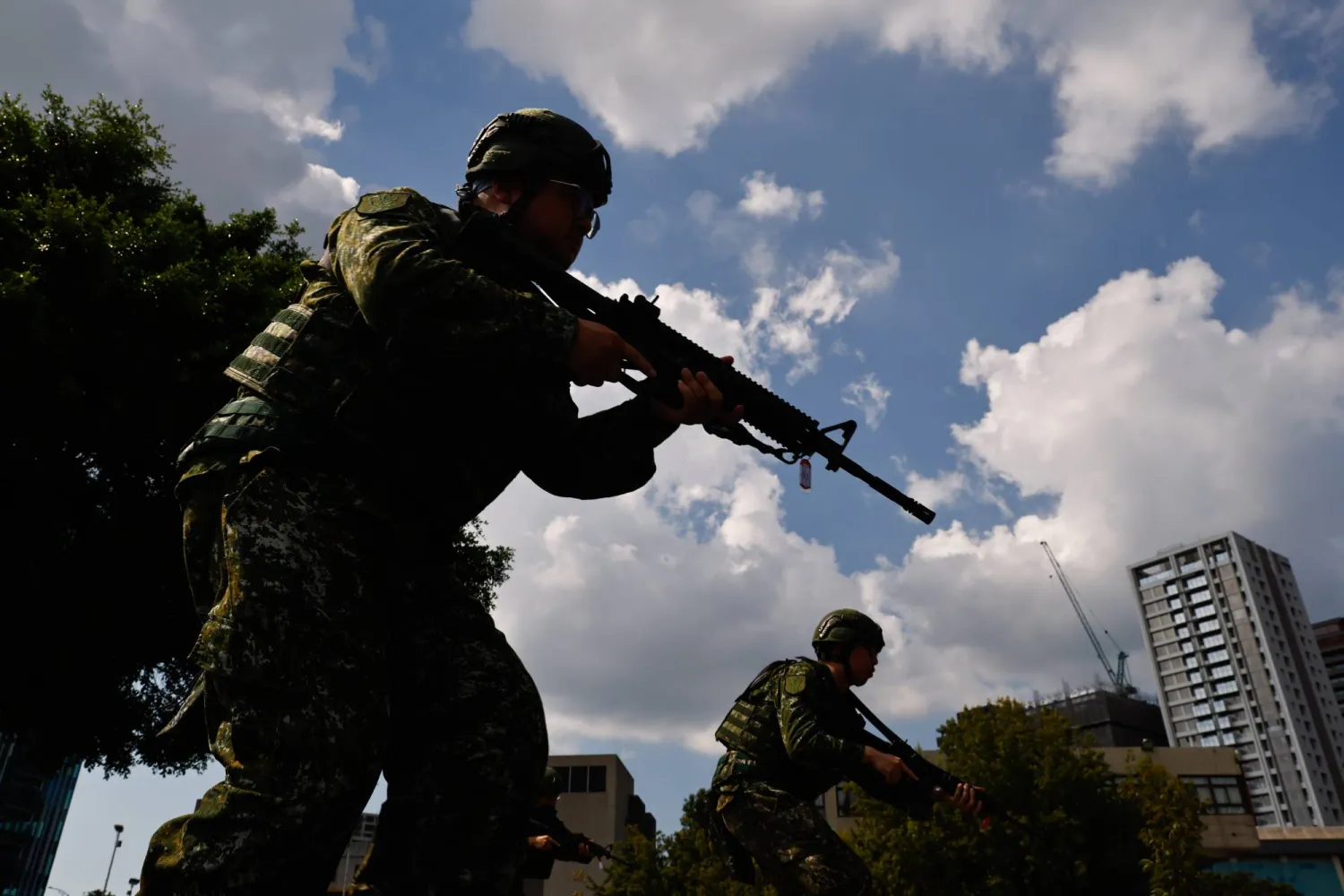 Taiwan military reservists conduct a rifle handling and shooting drill during combat training as part of the Annual Han Kuang military exercises in Taipei, Taiwan, 05 August 2026. (EPA)