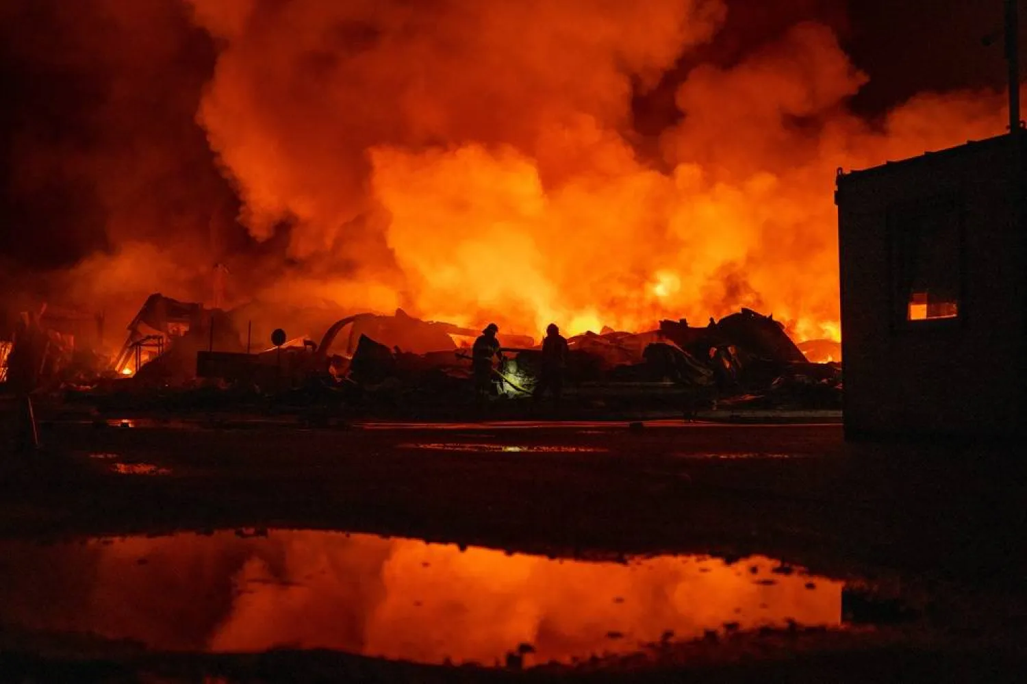 Firefighters put out a fire after Russian missiles hit a warehouse in Kyiv, Ukraine, Wednesday, Aug. 5, 2026. (AP)