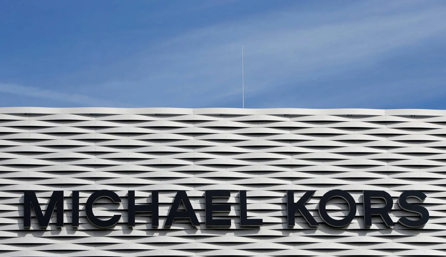 The logo of Michael Kors is seen on an outlet store in Metzingen, Germany, June 16, 2017. (Reuters)
