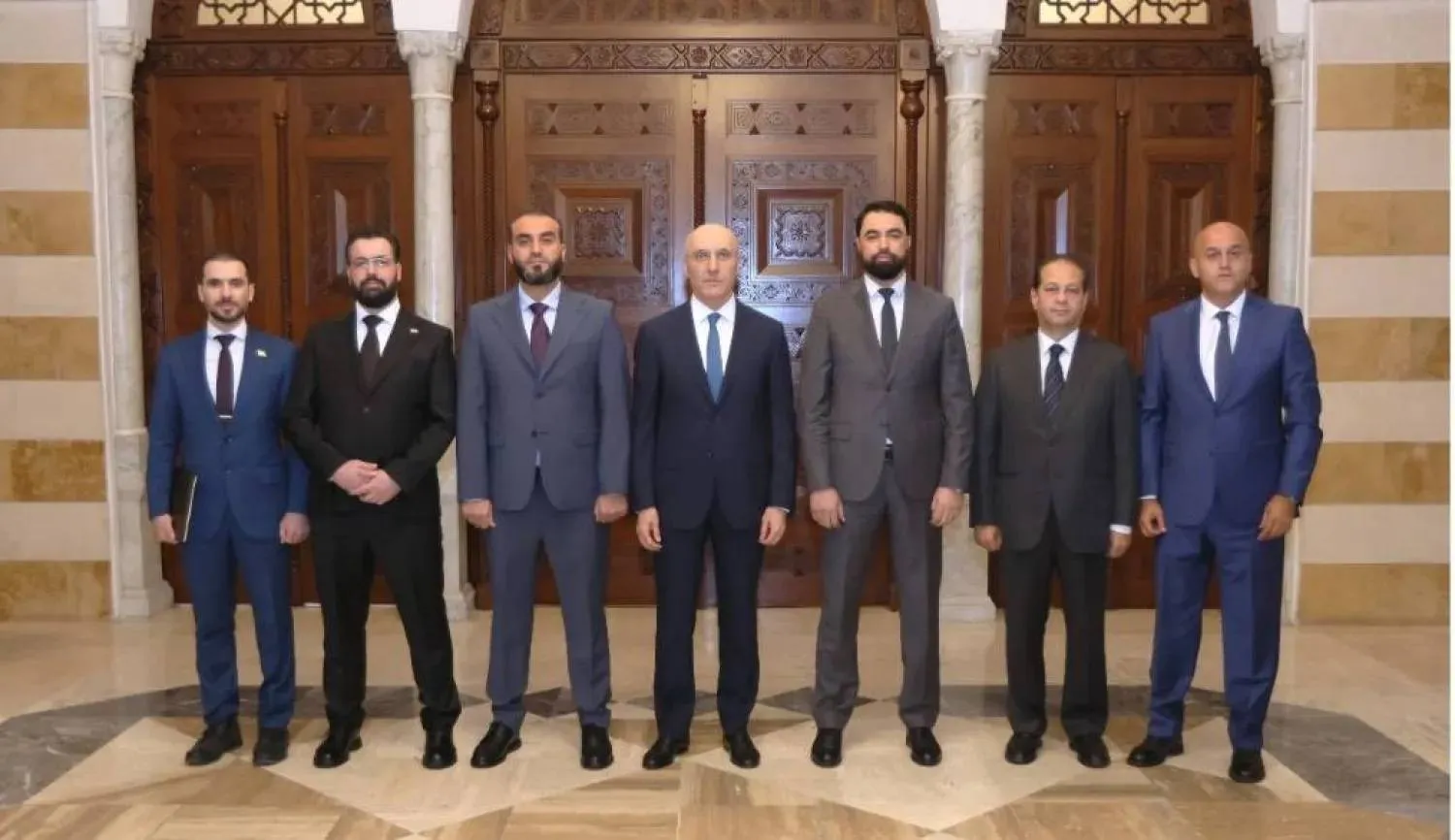 Lebanese Interior Minister Ahmed al-Hajjar receives Syrian Assistant Interior Minister for Security Affairs Brigadier General Mulham al-Shantout and his accompanying delegation. (National News Agency) 
