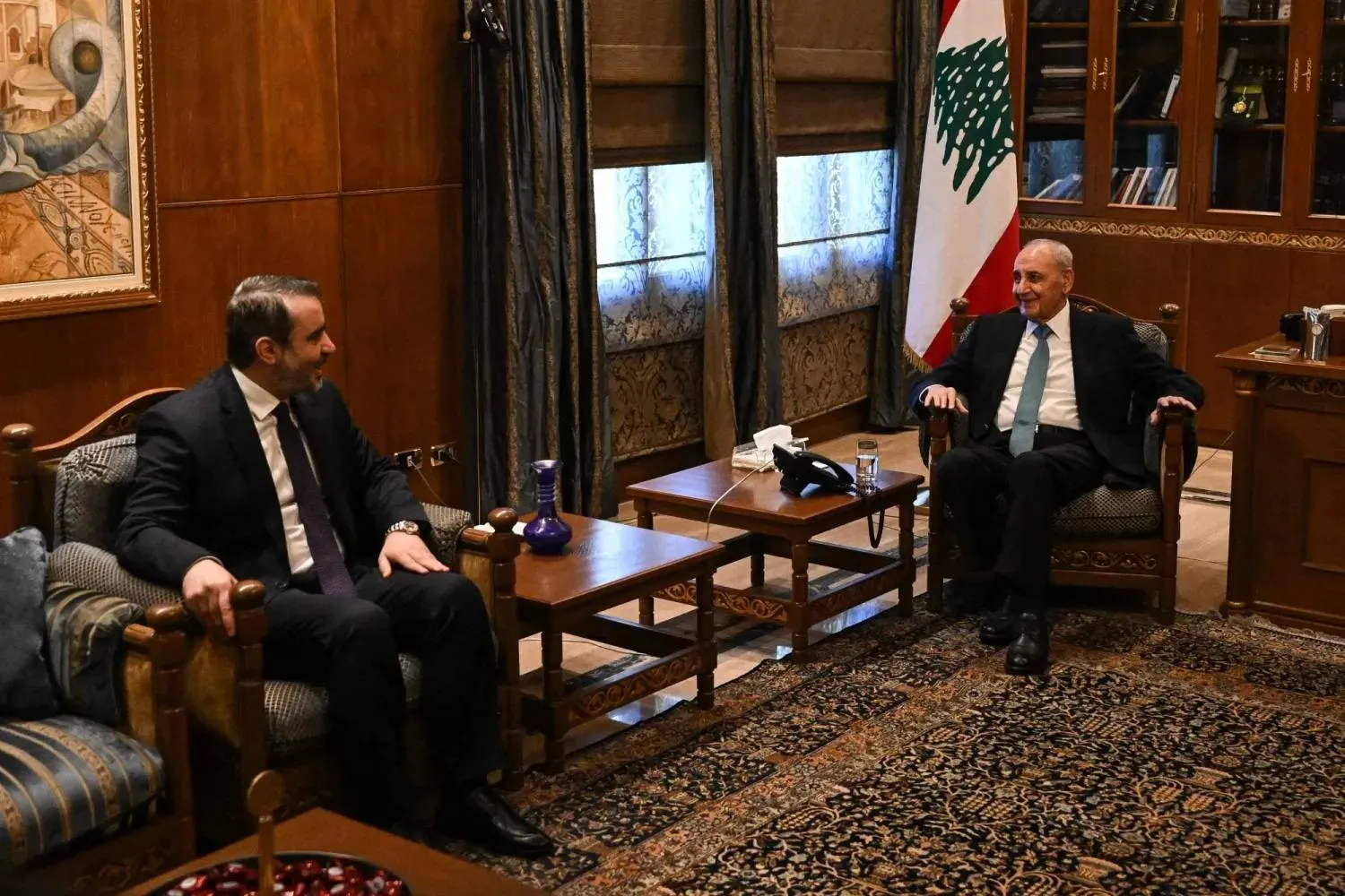 Syrian Foreign Minister Asaad al-Shaibani, left, meets Lebanese Parliament Speaker Nabih Berri at Berri’s residence in Beirut. (AFP)