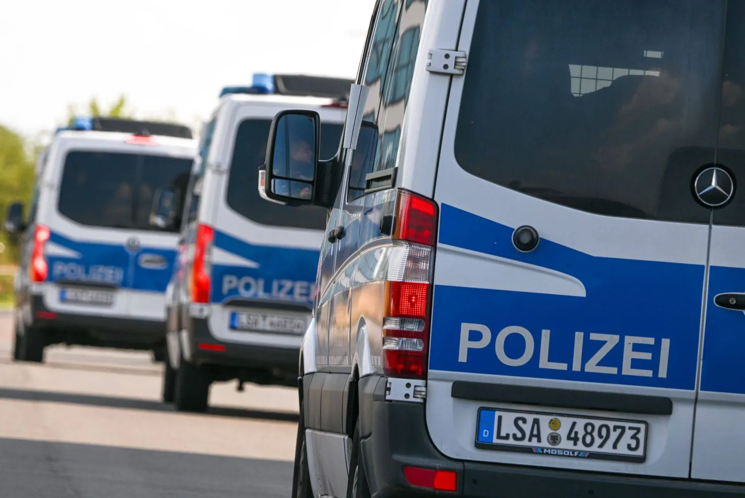 05 August 2026, Saxony, Schkeuditz: Police vehicles are parked at Leipzig/Halle Airport, following the nighttime drone incident. Photo: Hendrik Schmidt/dpa